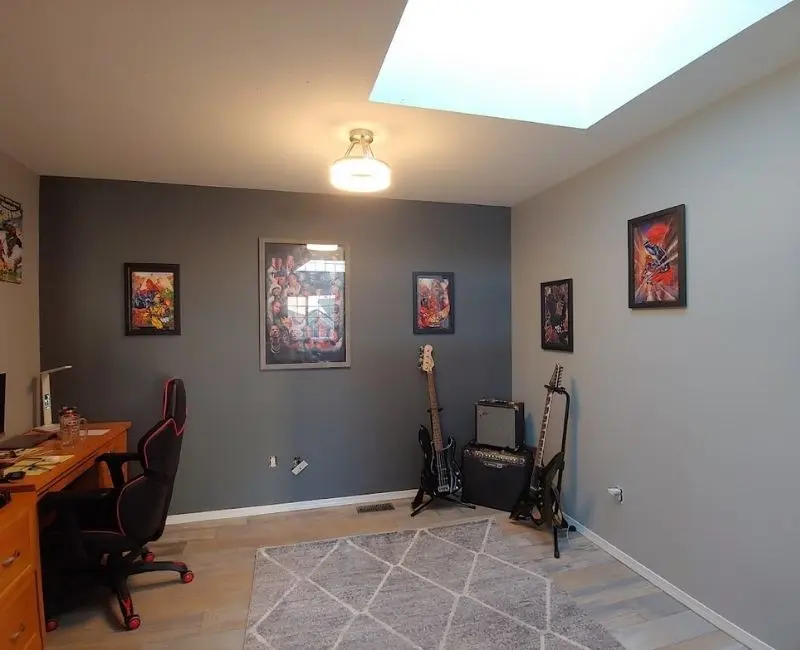 Painting services in Red Deer showing a dark grey accent wall in a modern home office.